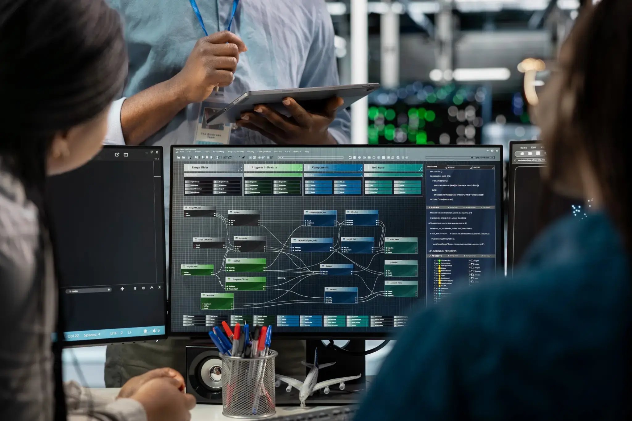 business-team-develops-application-on-multiple-computers